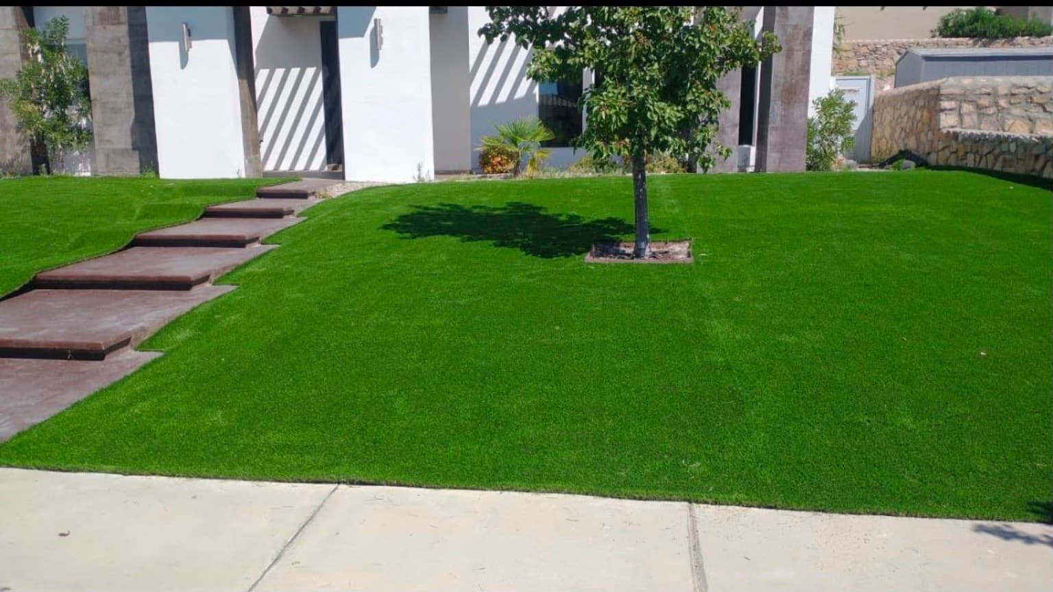 Finished residential artificial turf landscape